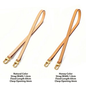 May include: Two leather bag straps in natural and honey colors. Each strap is 1.0cm wide and 60cm long, with a 4mm clasp opening. The straps have gold-colored clasps and are designed for handbags.