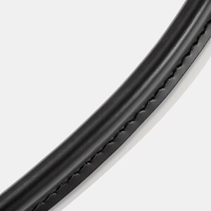 May include: Close-up of a curved, black leather handle with visible stitching. The handle appears smooth and slightly glossy, suggesting a high-quality material. The stitching is a contrasting color, adding detail to the design.
