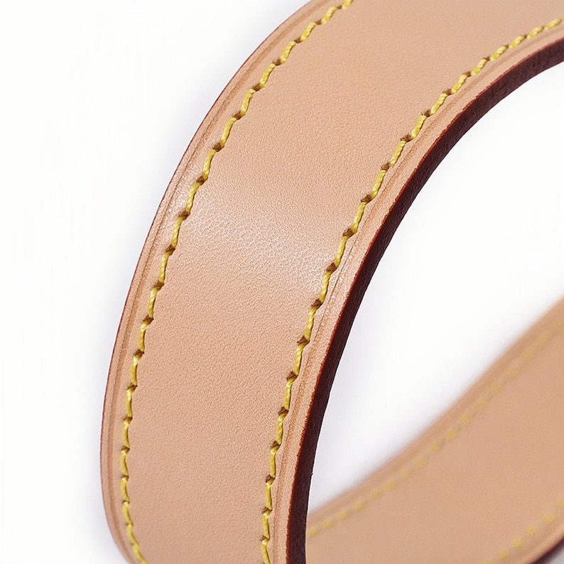 Close-up of vachetta leather handbag strap - natural color