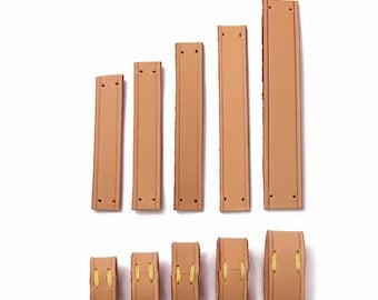 May include: Five tan leather bag strap loops arranged in a row, shown both as flat strips with pre-punched holes and as assembled loops secured with yellow thread. The text Leather Bag Strap Loop is visible at the top of the image.