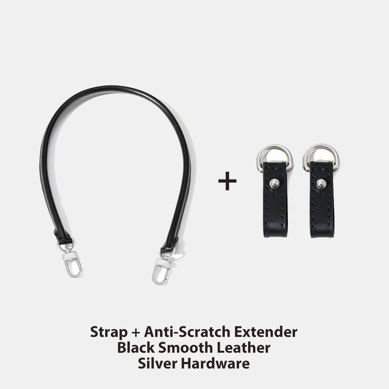 May include: A black smooth leather bag strap with silver hardware and two matching anti-scratch extenders. The strap is curved and has a silver clasp on each end. The text on the image reads: Strap + Anti-Scratch Extender, Black Smooth Leather, Silver Hardware.