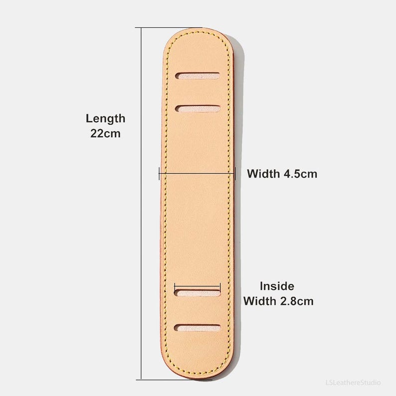 May include: A light tan leather shoulder strap pad with a length of 22cm, a width of 4.5cm, and an inside width of 2.8cm. The pad has three rectangular slots and is stitched around the edges.