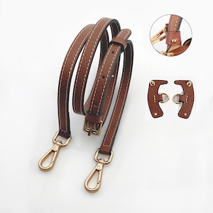 May include: Brown leather purse strap with white stitching, a gold-colored buckle, and gold-colored swivel clasps. Includes two additional leather pieces with gold-colored rings for attachment. Accessories for handbags.