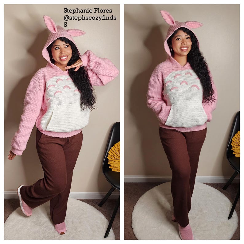 May include: A pink hooded sweater with bunny ears, a white pocket, and a cartoon design. The sweater is paired with brown pants and pink shoes. Text on the image reads "Stephanie Flores @stephscozyfinds S".