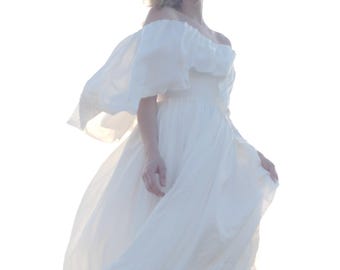 Romantic off-the-shoulder ivory wedding dress with ruffle