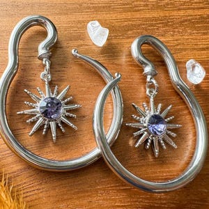 Silver Steel Spiral Hangers w/Silver Tone Sun Ft. Purple Center Plugs Earrings