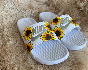 white sunflower nike sandals