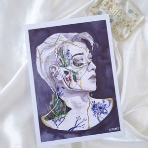 May include: A watercolor painting of a person's face with cracks and gold lines. Flowers and plants grow from the cracks, and the person's eyes are closed. The background is a dark purple.