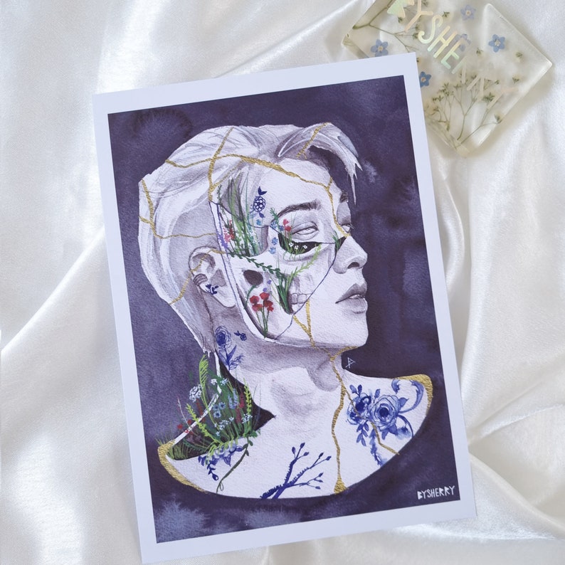 May include: A watercolor painting of a person's face with cracks and gold lines. Flowers and plants grow from the cracks, and the person's eyes are closed. The background is a dark purple.