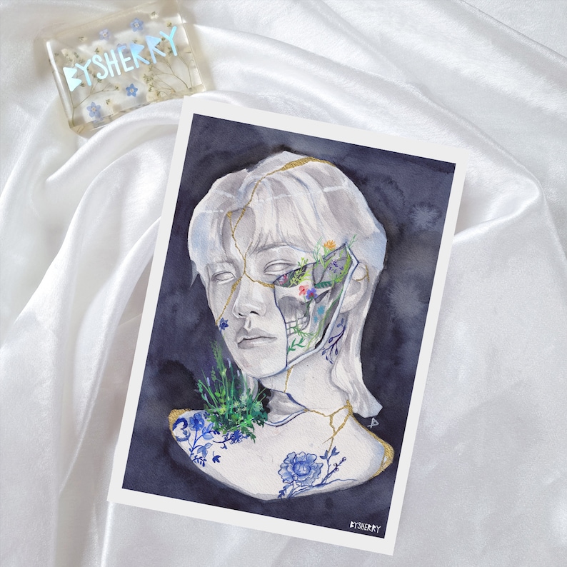 May include: Watercolor painting of a person's face with cracks and flowers growing from the cracks. The person's face is white and the flowers are blue, pink, and yellow. The background is dark blue.