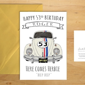 May include: A white birthday card featuring a cartoon illustration of a white Volkswagen Beetle with a red, white and blue racing stripe and the number "53" on the side. The text "Happy 53rd Birthday Roger" is at the top of the card. The text "Here Comes Herbie" is at the bottom of the card with the text "Beep Beep" underneath.