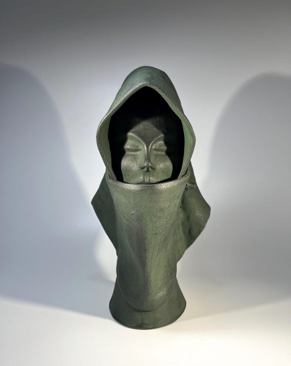 Singularly Intriguing Clay Bust Of A Cloaked Woman