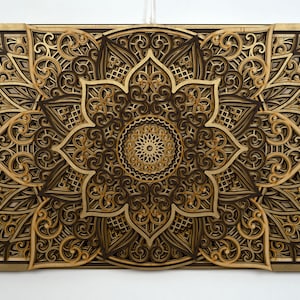 Handcrafted multi-layer boho mandala decor featuring detailed laser-cut patterns and floral geometry.