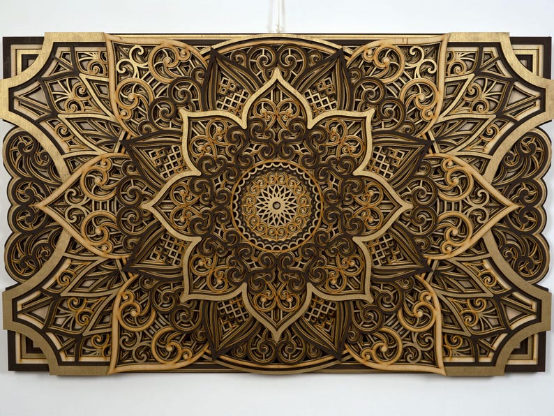Handcrafted multi-layer boho mandala decor featuring detailed laser-cut patterns and floral geometry.