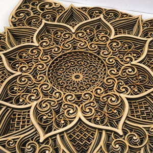 Close-up of wooden mandala showing precise laser cut details and intricate craftsmanship