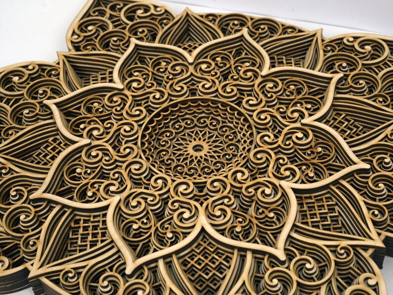 Close-up of wooden mandala showing precise laser cut details and intricate craftsmanship