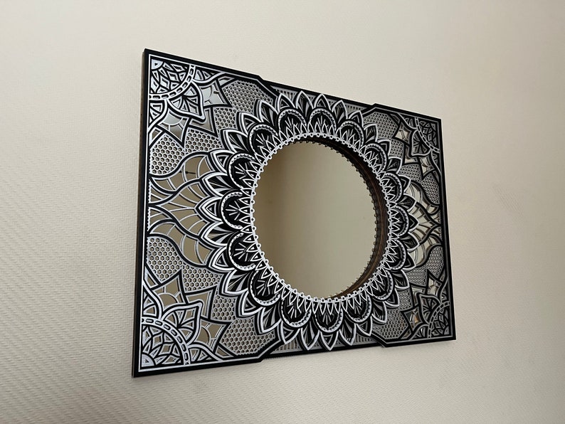 Eye-catching mandala mirror art reflecting natural light, bringing a refined and spacious feel to sleek interiors
