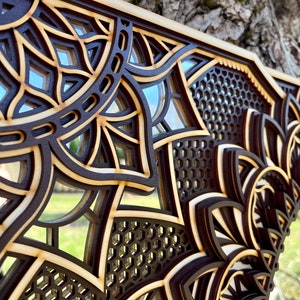 Intricately patterned mandala mirror in a smooth circular form, seamlessly blending with modern design aesthetics