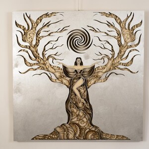 Decorative mandala piece highlighting the energetic essence of the divine feminine in richly textured wood