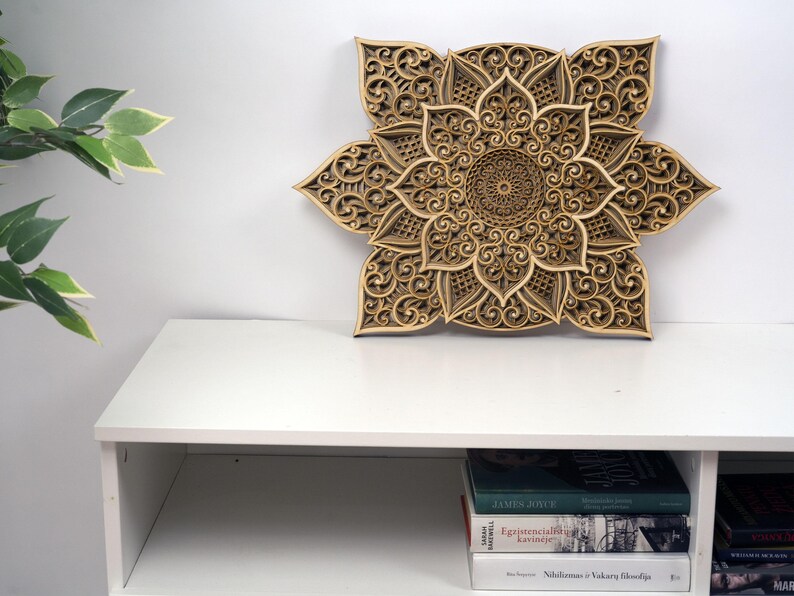 Large wooden mandala wall decor with intricate laser cut design displayed as a statement wall piece