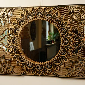 Modern mirror mandala wall hanging combining metallic accents and delicate cutouts, ideal for upscale urban decor