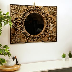 Minimalist mandala mirror featuring layered reflective shapes, enhancing light and depth for a fresh, modern vibe