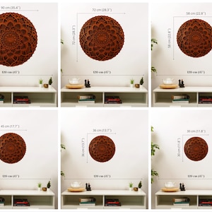 May include: Six different sizes of brown wooden wall decor with a mandala design. The decor is shown on a white wall with a shelf underneath. The sizes are 90 cm (35.4 inches), 72 cm (28.3 inches), 58 cm (22.8 inches), 45 cm (17.7 inches), 36 cm (13.7 inches), and 30 cm (11.8 inches).