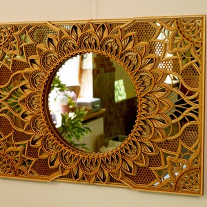 Large circular mirror mandala showcasing subtle etched details, creating a stylish focal point in a modern home