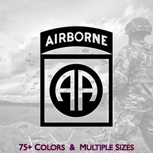 May include: Black and white graphic featuring the word "AIRBORNE" above a square with a circular emblem containing the letters "AA". The image includes a soldier in camouflage and the text "75+ COLORS & MULTIPLE SIZES".