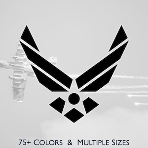 May include: Black and white graphic of the United States Air Force symbol with a star and wings design. An airplane is in the background. Text at the bottom reads "75+ COLORS & MULTIPLE SIZES."