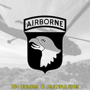 May include: Black and white emblem featuring an eagle's head and the word "AIRBORNE" at the top. The emblem is set against a backdrop of helicopters and a mountainous landscape. Text at the bottom reads "75+ COLORS & MULTIPLE SIZES".