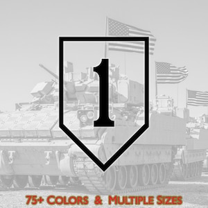 May include: Black and white graphic featuring the number "1" inside a shield-shaped emblem, set against a backdrop of military vehicles and American flags. Text at the bottom reads "75+ COLORS & MULTIPLE SIZES".