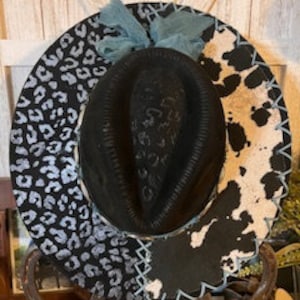 Leopard print Galore with Cowhide print on a black Suede Cowboy hat hand painted