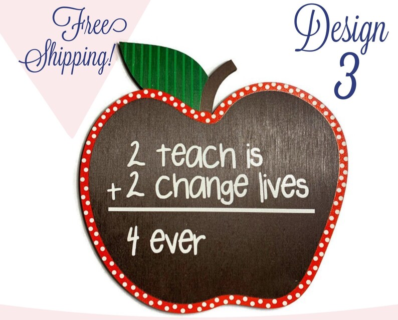 May include: Red apple-shaped chalkboard with white polka dots around the edge. The chalkboard has the words "2 teach is + 2 change lives" written on it with a line underneath. Below the line is the word "4 ever".
