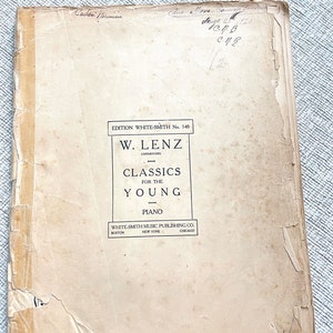 May include: A vintage sheet music cover for piano, titled "Classics for the Young" by W. Lenz, arranged by W. Lenz. The cover is printed on cream-colored paper with black text and is slightly worn.