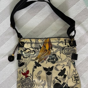 SAKROOTS crossbody bag Women's yellow/black shoulder bag. Multicolor floral coated canvas medium purse