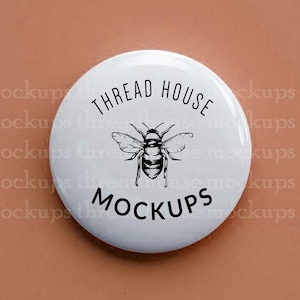 May include: A white button with the text "THREAD HOUSE MOCKUPS" and a detailed illustration of a bee. The button is centered on a solid, muted orange-brown background.