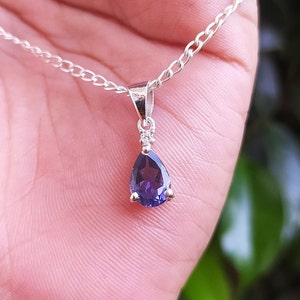 Iolite Pear Pendant Necklace: Sterling Silver Solitaire, White Topaz Accent