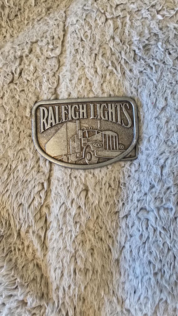 Vintage Raleigh Lights Truck Advertisement Belt Buckle