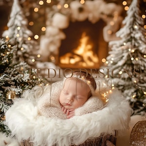 May include: A newborn baby sleeping in a white fur-lined basket, wearing a white knitted sweater and a gold headband with lights. The baby is surrounded by a snowy, wintery scene with a fireplace and Christmas trees in the background.