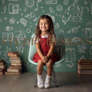 May include: A smiling girl in a red dress and white trainers sits on a pale blue chair. Behind her is a green chalkboard with white drawings and books. The image includes the text "STUDIO DESIGNS".