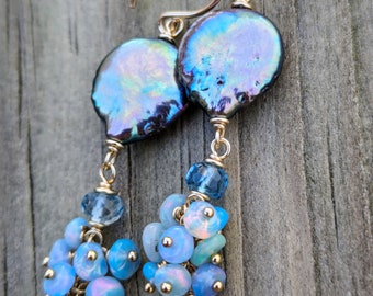 Blue peacock coin pearl earrings with swiss blue topaz and blue opal cluster