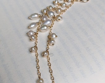 Long white pearl earrings