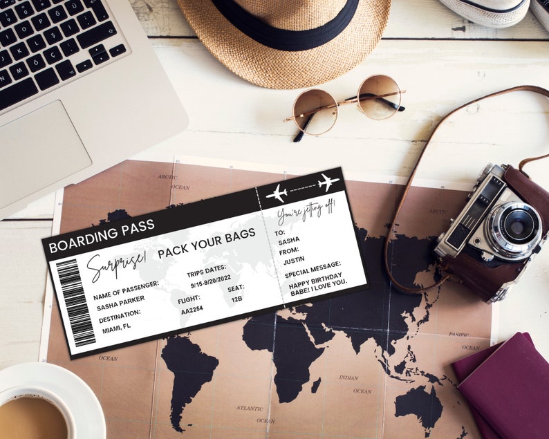 May include: A black and white boarding pass with the text "Surprise! Pack Your Bags" and "You're getting off!"  The boarding pass has a flight number, date, and seat number. The text "To: Sasha, From: Justin, Special Message: Happy Birthday Babe! I Love You." is on the boarding pass.