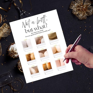 May include: A white paper game sheet with the text "Not a butt, but what?" and "Not what you think!" with nine photo-like images. A hand holds a pen, ready to write. The background is dark with gold decorations.