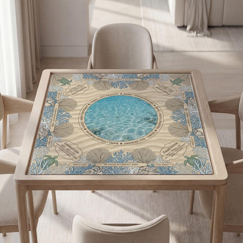 a square table with a decorative tile top, displaying a seascape design with a blue water feature and marine life. The table is surrounded by four chairs, and there is a couch in the background.