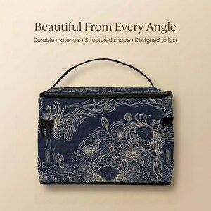 A blue and white patterned bag with a handle, placed against a beige background.