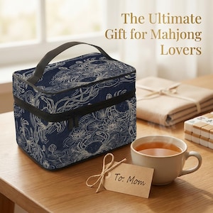 a blue and white floral bag, a cup of tea, and a card with a message for a mother, all placed on a wooden table.
