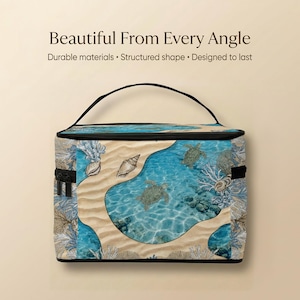 a blue and white tropical-themed bag with a sandy beach and ocean scene printed on it.