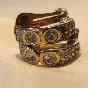 Earrings vintage clips half-ring, two large round rhinestones gathered in the center and two rows of rhinestones on either side